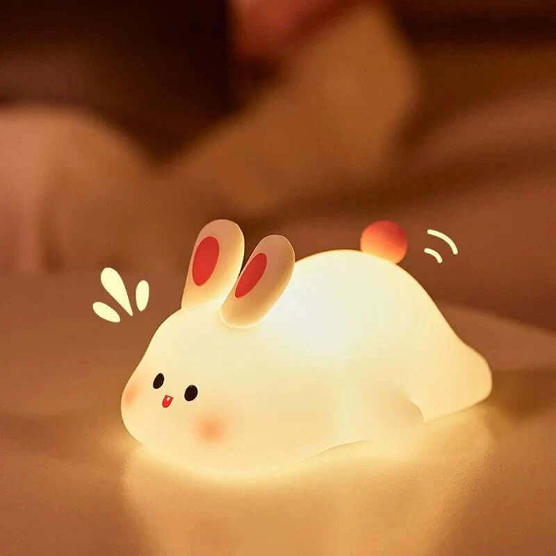 Bunny night light with a soft glow, made from safe silicone, perfect for kids' rooms.