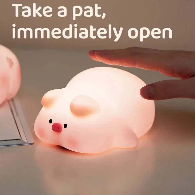 Pig night light with gentle glow and USB rechargeability.