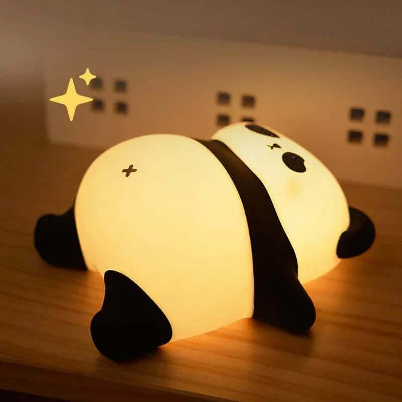 Adorable Sleeping Panda Night Light on wooden table, emitting warm glow for cozy ambiance.