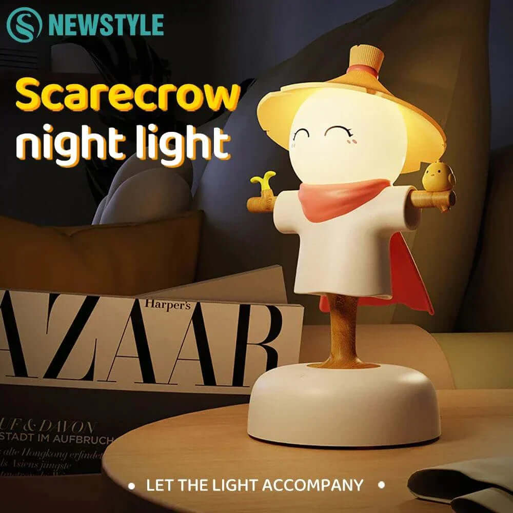 Cute Scarecrow Night Light with dimmable brightness levels and USB rechargeable feature on a bedside table.