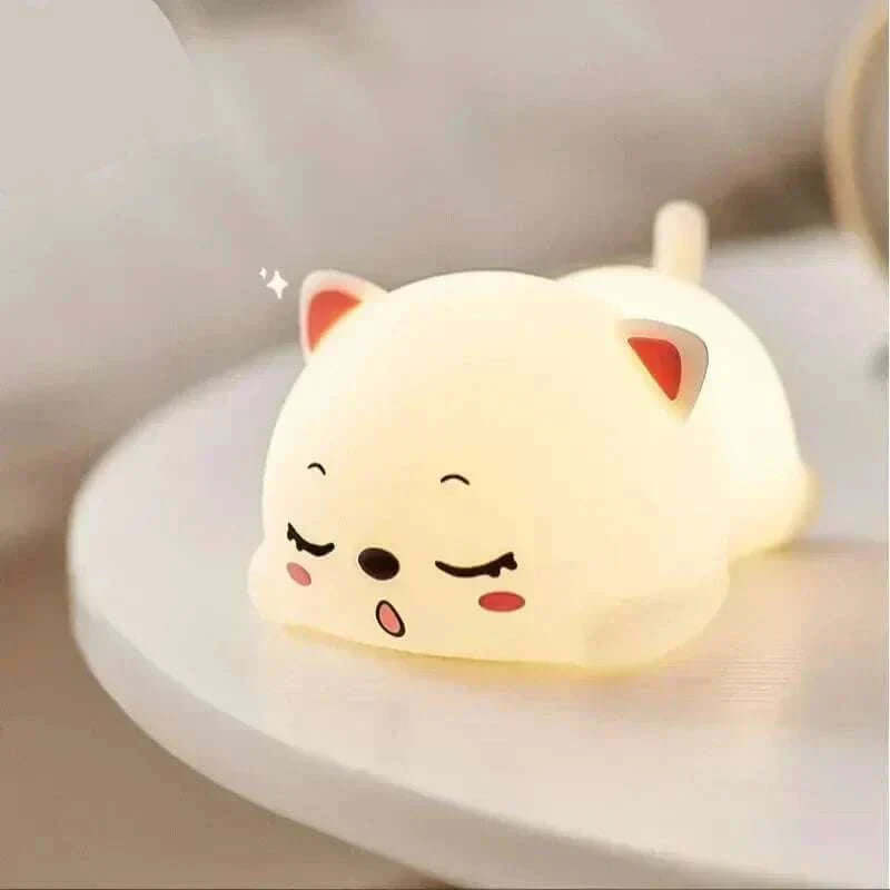 Adorable silicone cat night light providing a soft, calming glow with touch sensor and remote control for children's room.