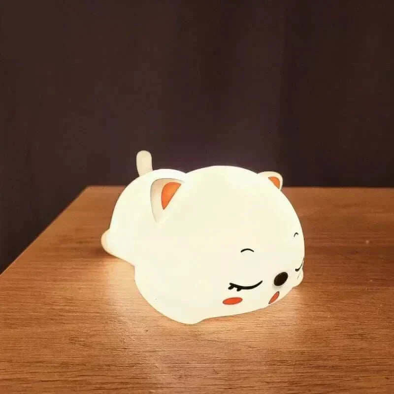 Lovely Cat Night Light on table, providing a soft glow with touch sensor and remote control features.