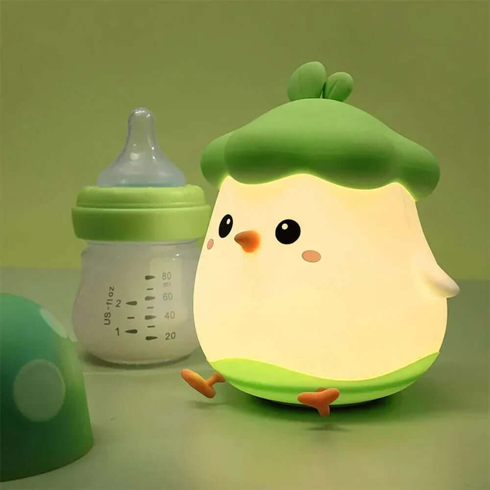 Veggie Chick Night Light with cozy LED glow, chick-shaped, USB rechargeable, and eco-friendly silicone design.