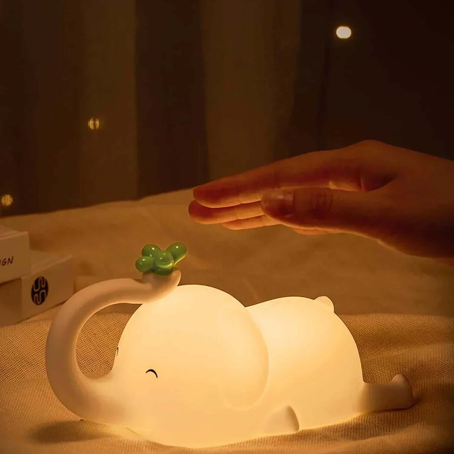 Baby Elephant Night Light made of soft, BPA-free silicone with dimmable and timed settings for a cozy, child-friendly atmosphere.