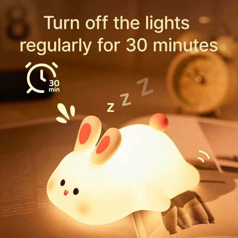 Adorable rabbit-shaped silicone night light with USB rechargeability and timer function, perfect for kids' rooms and bedtime routines.